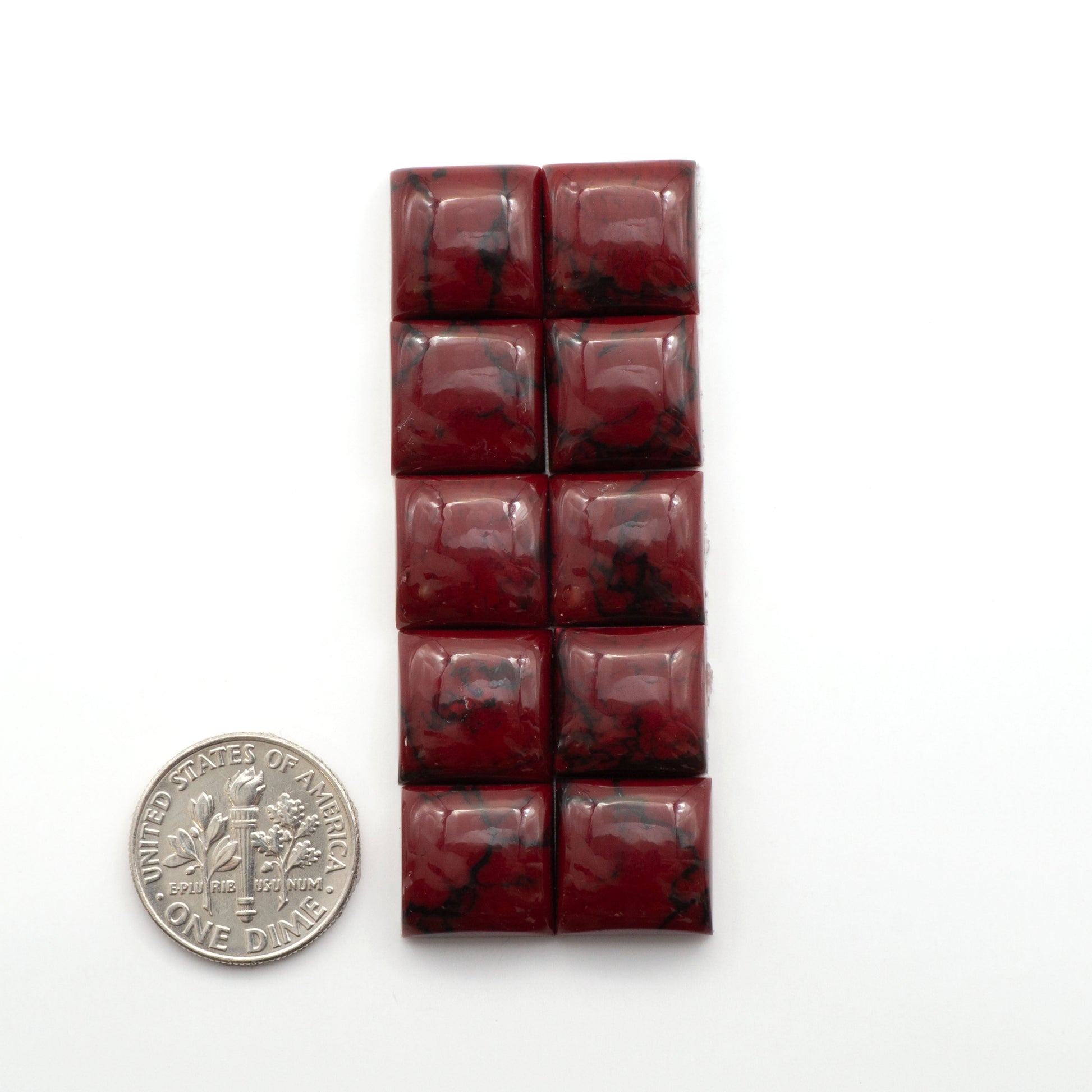 Bloody Bison Jasper is a composite stone with a vibrant red hue and black matrix that creates a strong impression and a touch of opulence to any jewelry piece.