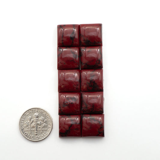 Bloody Bison Jasper is a composite stone with a vibrant red hue and black matrix that creates a strong impression and a touch of opulence to any jewelry piece.
