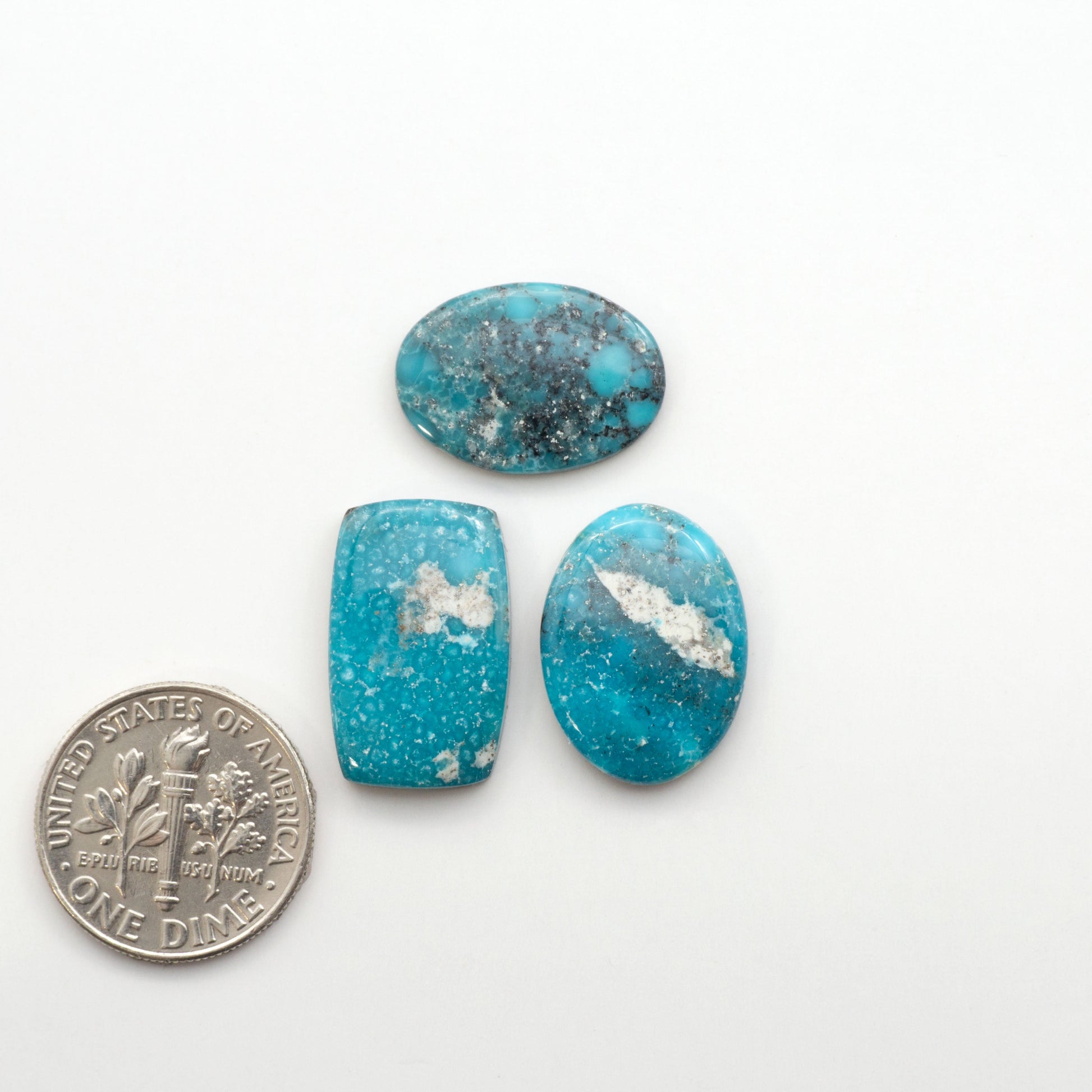White Water Turquoise Cabochons with their mesmerizing patterns and one-of-a-kind colors, are perfect for those looking for a unique and eye-catching piece.

