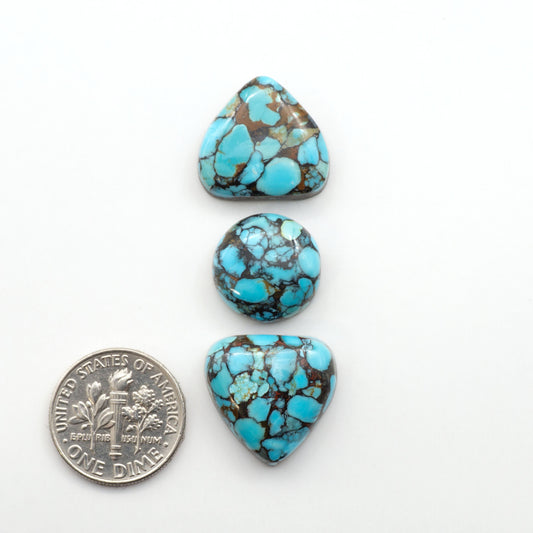 Enhance your jewelry designs with Pressed Turquoise Nugget Cabochons. Crafted from composite materials they add a captivating touch to your creations.