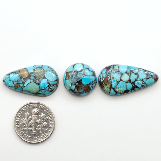 Enhance your jewelry designs with Pressed Turquoise Nugget Cabochons. Crafted from composite materials they add a captivating touch to your creations.