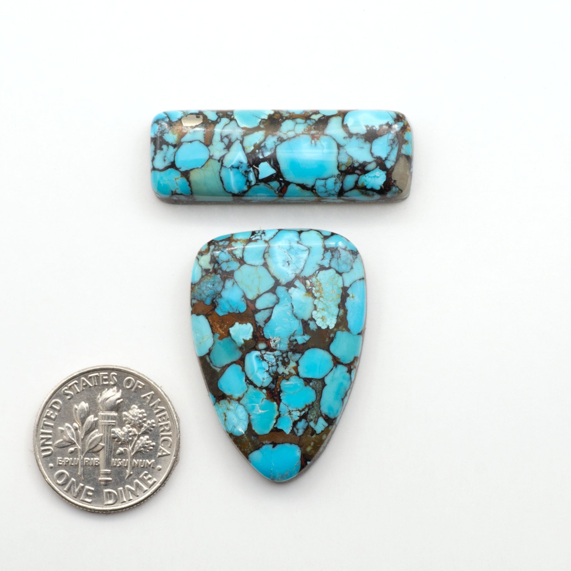 Enhance your jewelry designs with Pressed Turquoise Nugget Cabochons. Crafted from composite materials they add a captivating touch to your creations.