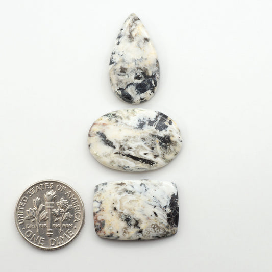 Natural White Buffalo Stone Cabochons are semi-precious gemstones cut into shapes ideal for jewelry-making, making them an excellent choice for artisans.