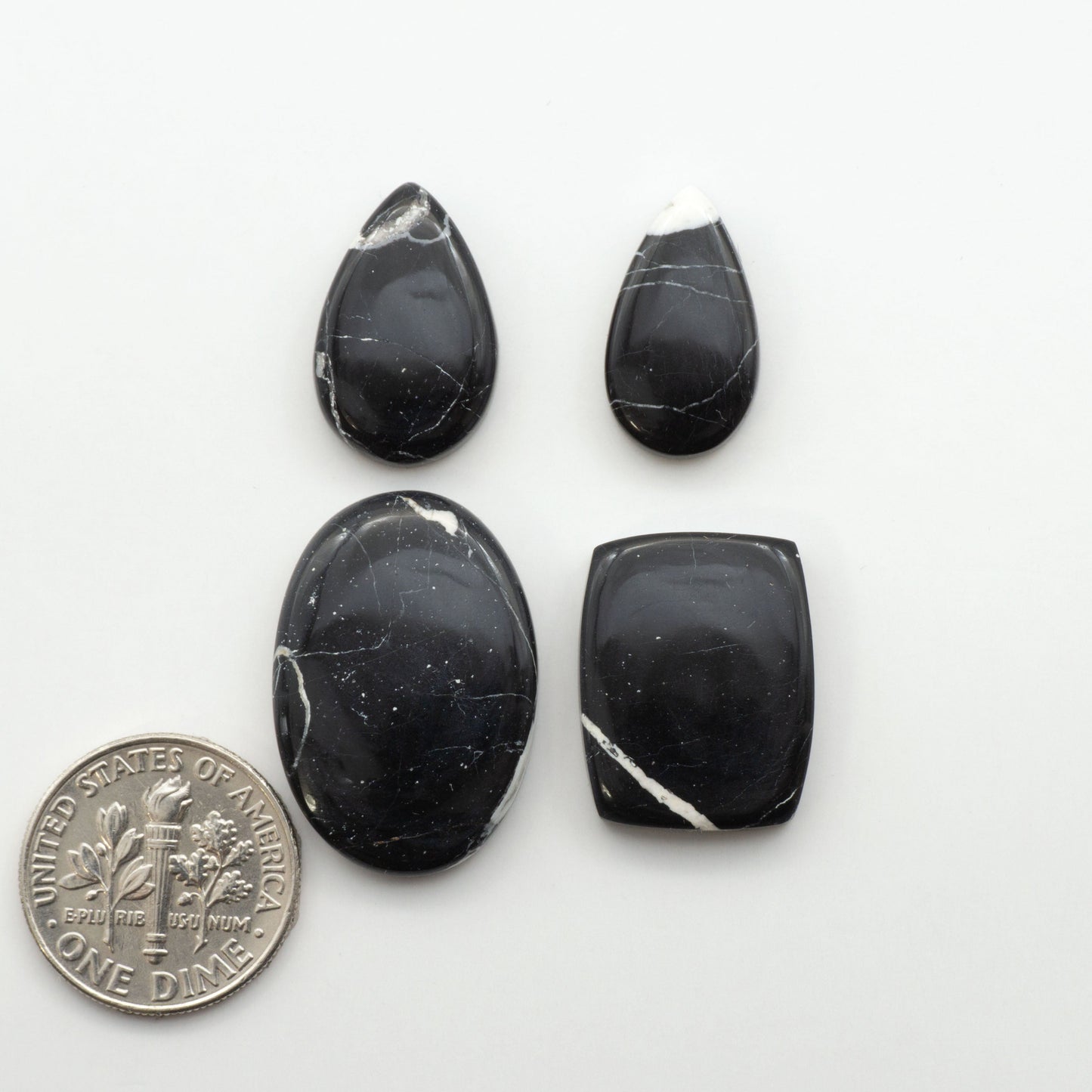 Natural White Buffalo Stone Cabochons are semi-precious gemstones cut into shapes ideal for jewelry-making, making them an excellent choice for artisans.