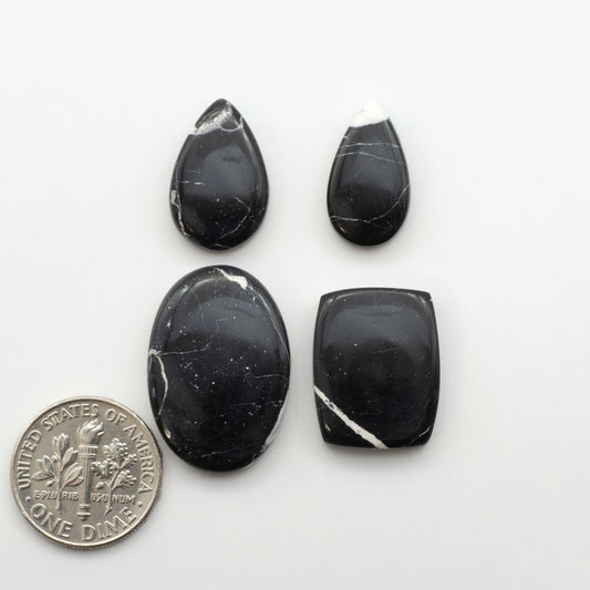 Natural White Buffalo Stone Cabochons are semi-precious gemstones cut into shapes ideal for jewelry-making, making them an excellent choice for artisans.