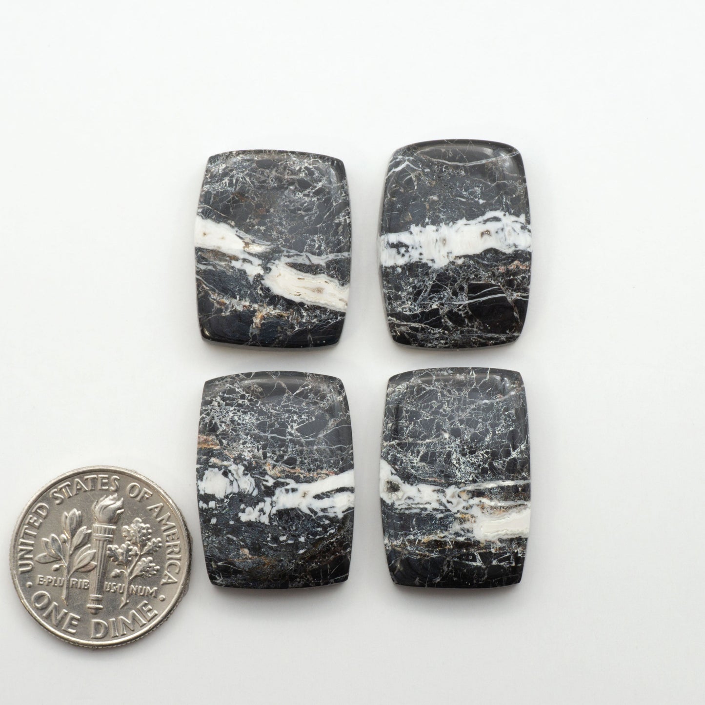 Natural White Buffalo Stone Cabochons are semi-precious gemstones cut into shapes ideal for jewelry-making, making them an excellent choice for artisans.