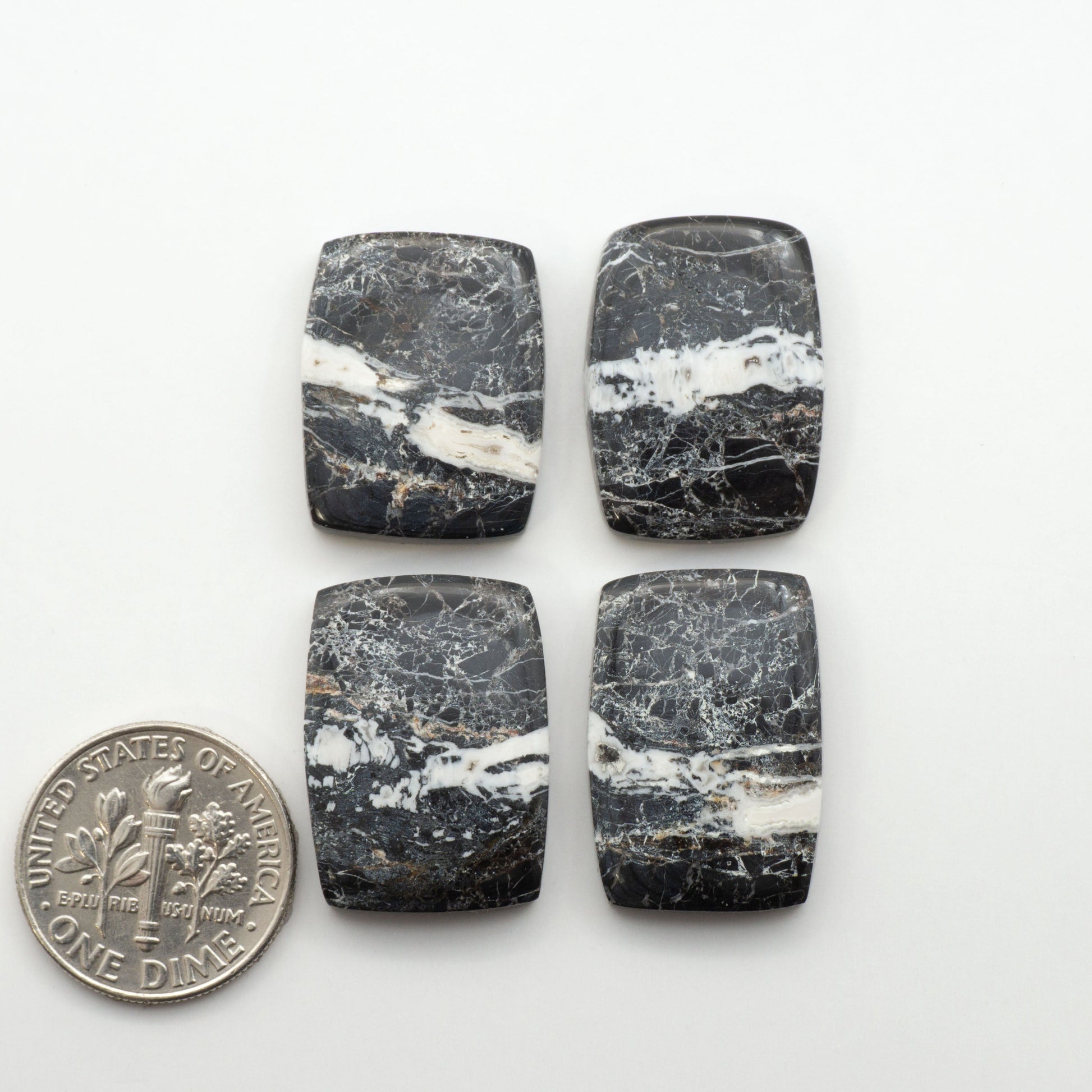 Natural White Buffalo Stone Cabochons are semi-precious gemstones cut into shapes ideal for jewelry-making, making them an excellent choice for artisans.