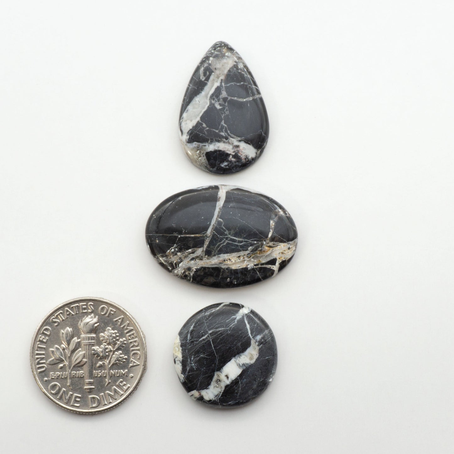 Natural White Buffalo Stone Cabochons are semi-precious gemstones cut into shapes ideal for jewelry-making, making them an excellent choice for artisans.