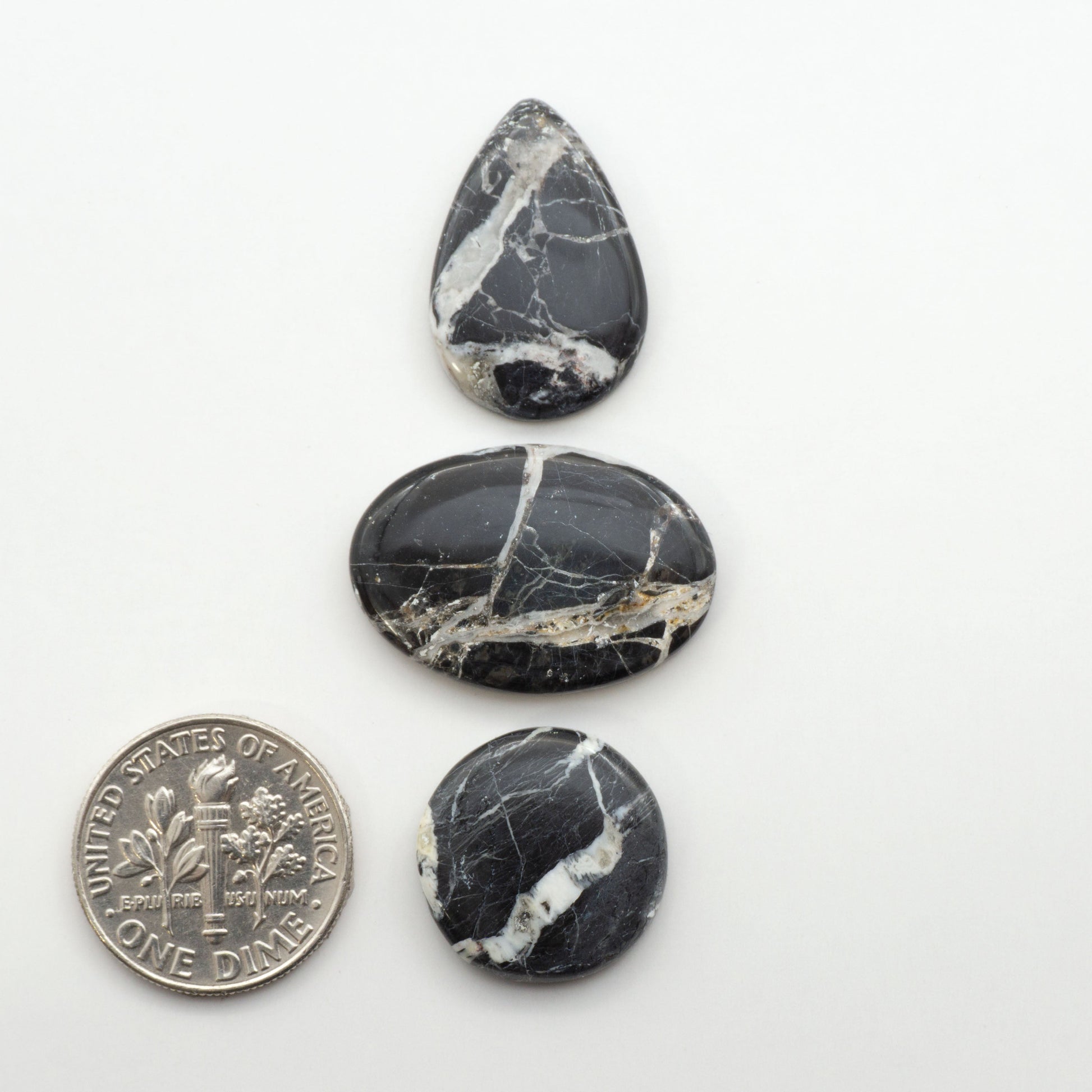 Natural White Buffalo Stone Cabochons are semi-precious gemstones cut into shapes ideal for jewelry-making, making them an excellent choice for artisans.