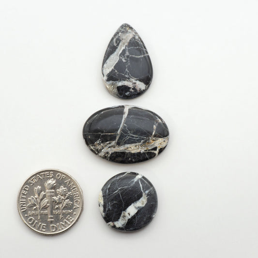 Natural White Buffalo Stone Cabochons are semi-precious gemstones cut into shapes ideal for jewelry-making, making them an excellent choice for artisans.