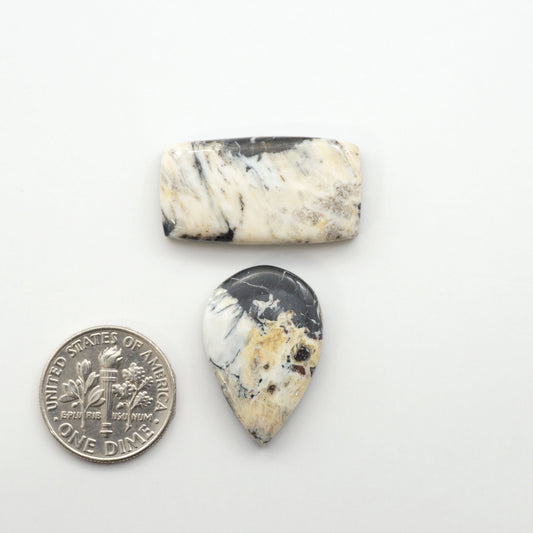 Natural White Buffalo Stone Cabochons are semi-precious gemstones cut into shapes ideal for jewelry-making, making them an excellent choice for artisans.