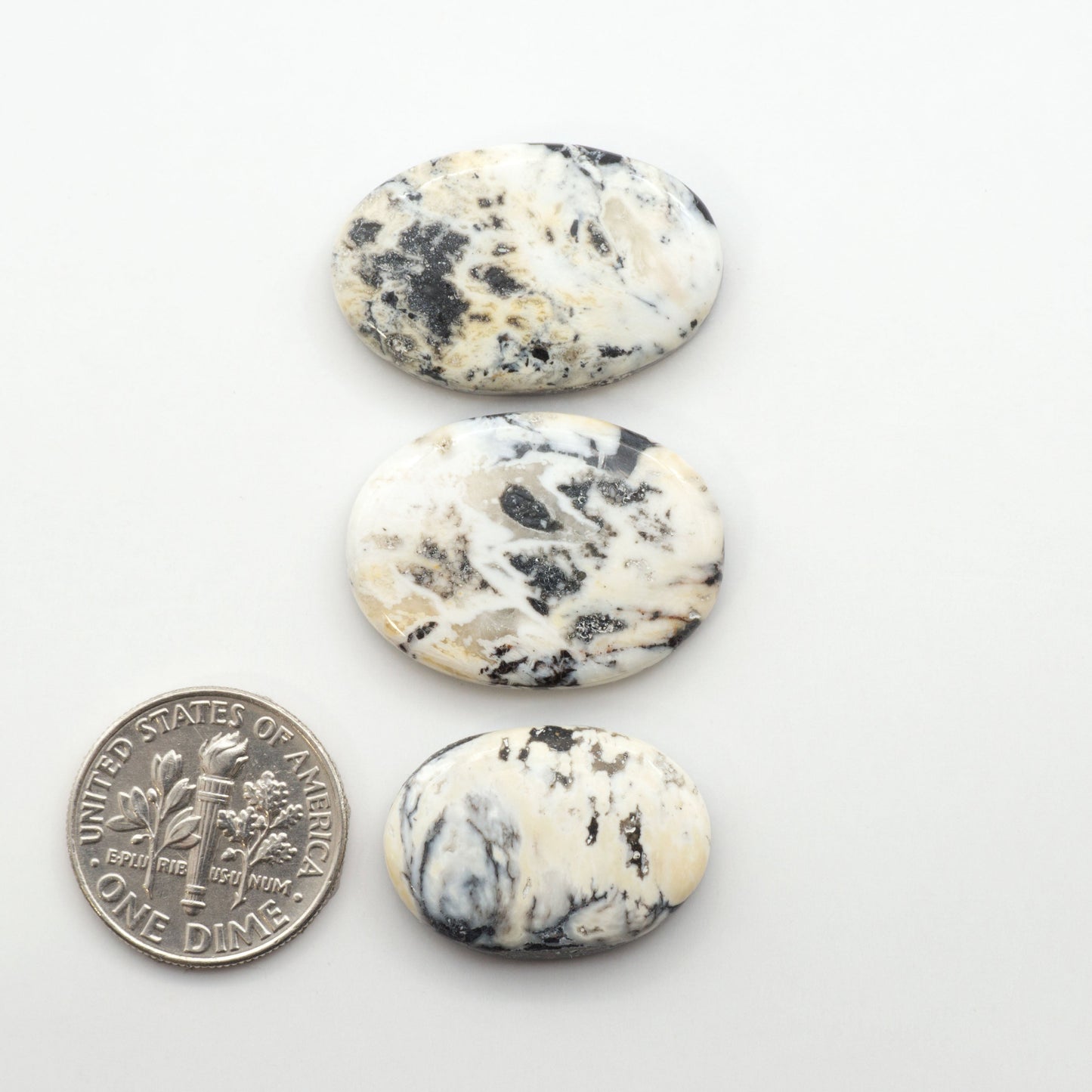 Natural White Buffalo Stone Cabochons are semi-precious gemstones cut into shapes ideal for jewelry-making, making them an excellent choice for artisans.