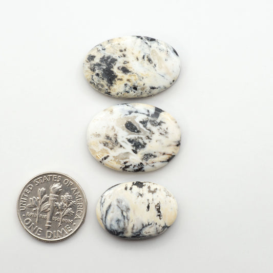 Natural White Buffalo Stone Cabochons are semi-precious gemstones cut into shapes ideal for jewelry-making, making them an excellent choice for artisans.