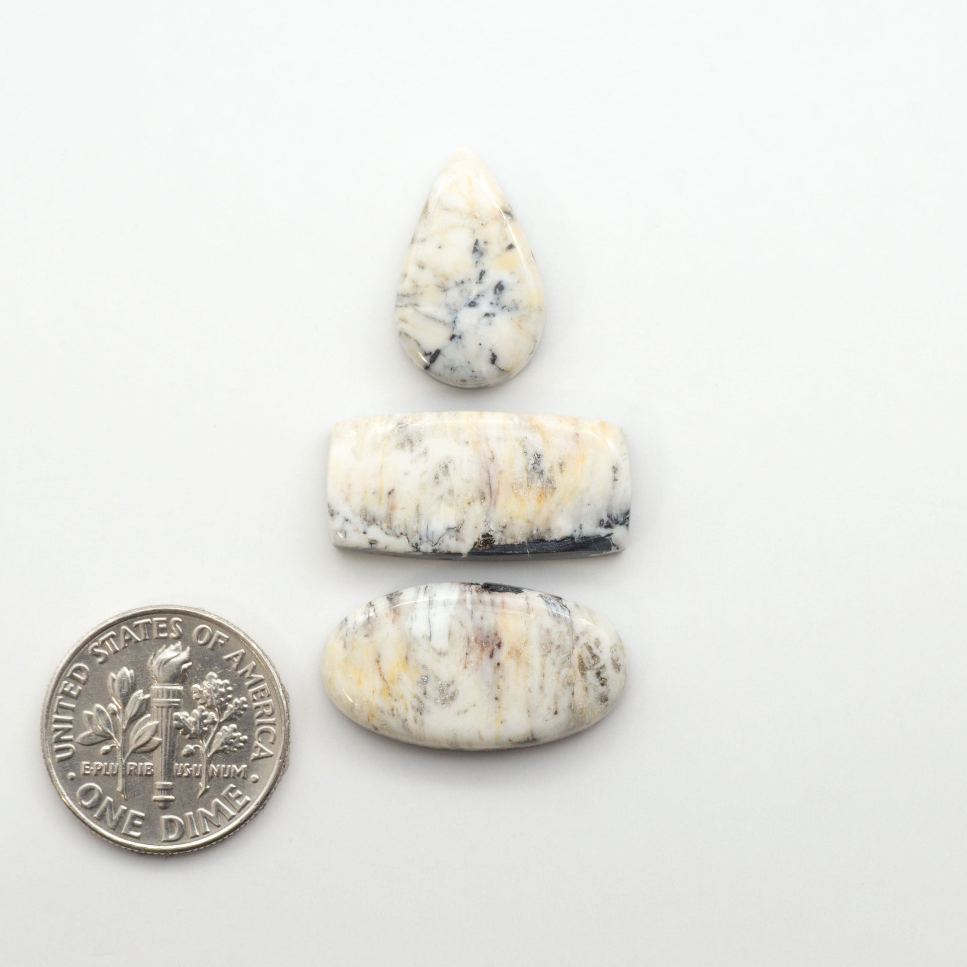 Natural White Buffalo Stone Cabochons are semi-precious gemstones cut into shapes ideal for jewelry-making, making them an excellent choice for artisans.