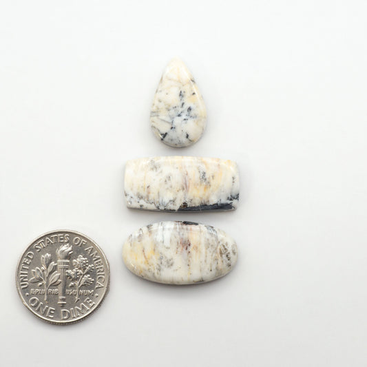 Natural White Buffalo Stone Cabochons are semi-precious gemstones cut into shapes ideal for jewelry-making, making them an excellent choice for artisans.