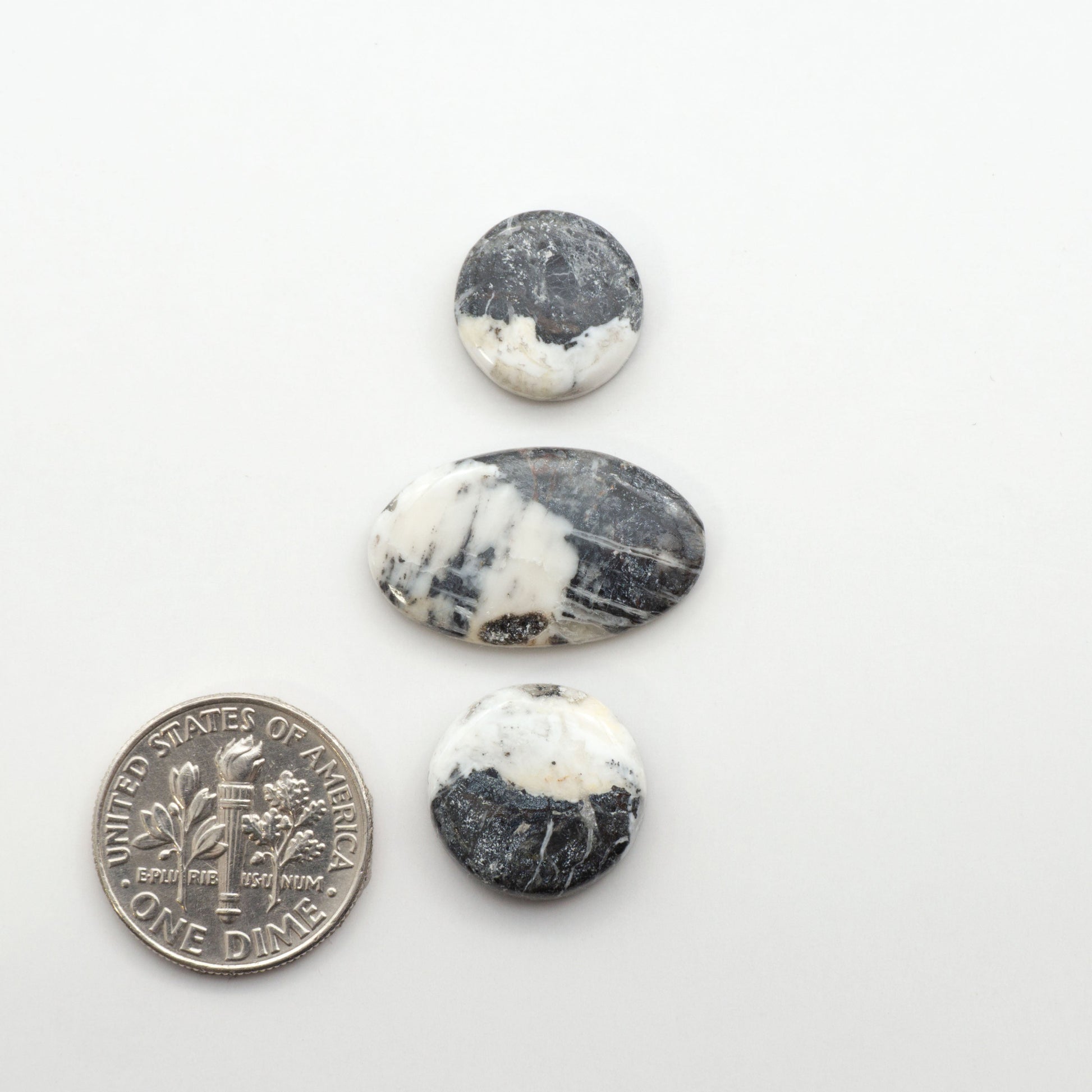 Natural White Buffalo Stone Cabochons are semi-precious gemstones cut into shapes ideal for jewelry-making, making them an excellent choice for artisans.