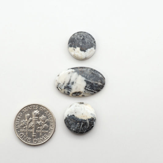 Natural White Buffalo Stone Cabochons are semi-precious gemstones cut into shapes ideal for jewelry-making, making them an excellent choice for artisans.
