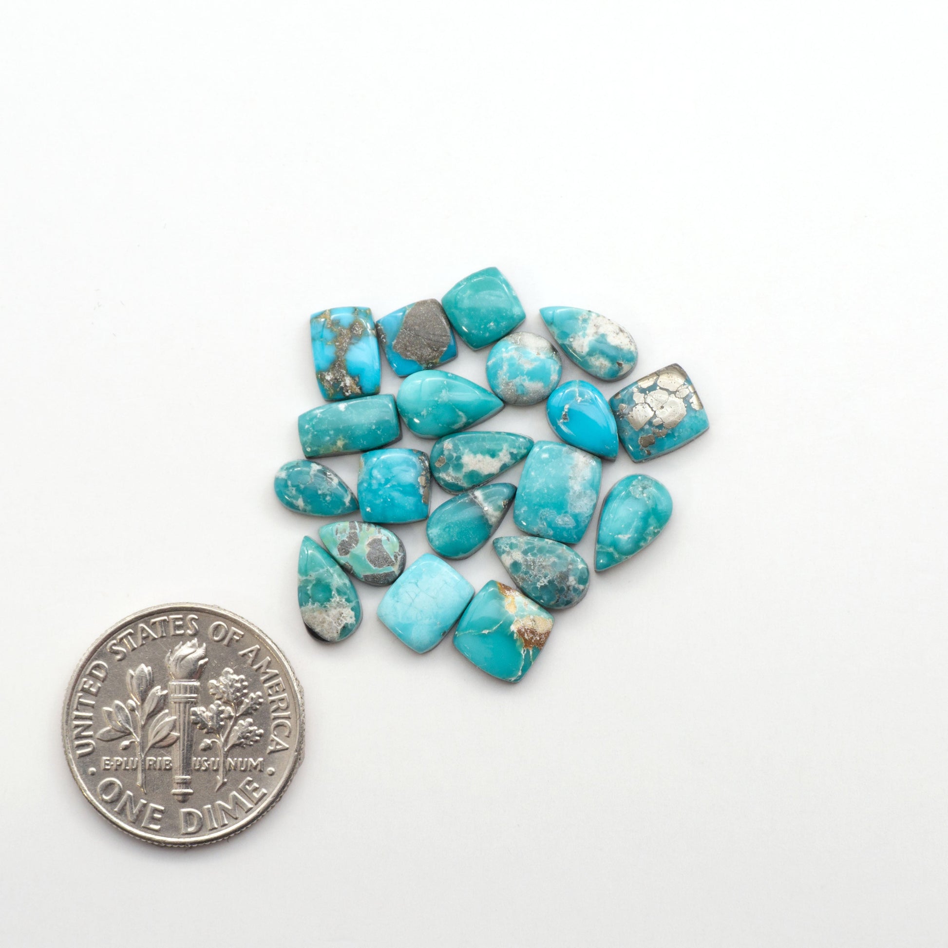 White Water Turquoise Cabochons with their mesmerizing patterns and one-of-a-kind colors, are perfect for those looking for a unique and eye-catching piece.