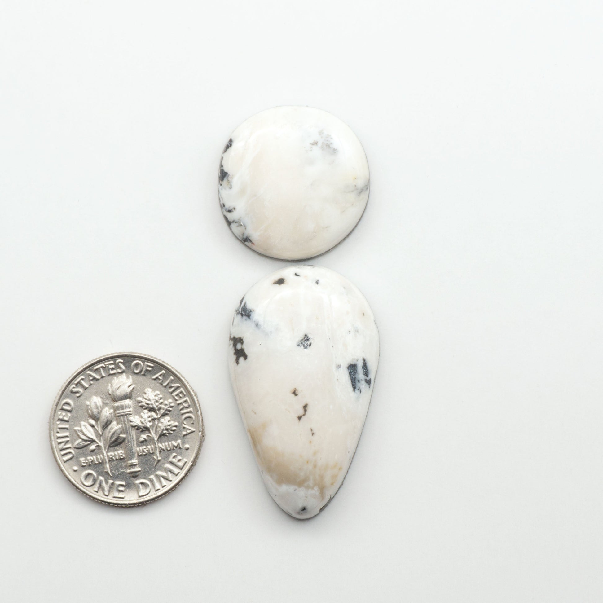 Natural White Buffalo Stone Cabochons are semi-precious gemstones cut into shapes ideal for jewelry-making, making them an excellent choice for artisans.