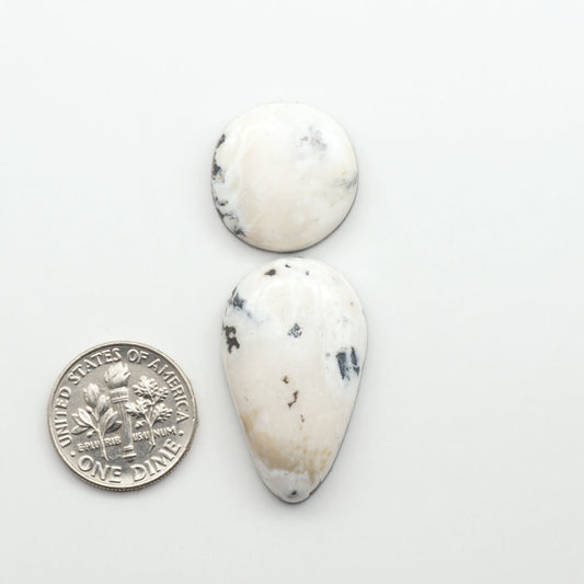 Natural White Buffalo Stone Cabochons are semi-precious gemstones cut into shapes ideal for jewelry-making, making them an excellent choice for artisans.