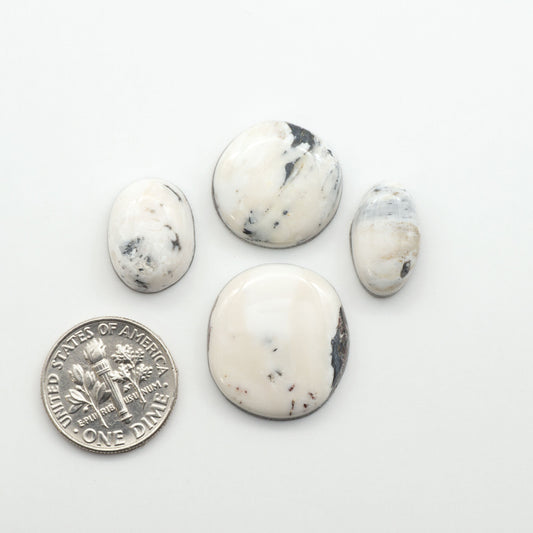 Natural White Buffalo Stone Cabochons are semi-precious gemstones cut into shapes ideal for jewelry-making, making them an excellent choice for artisans.