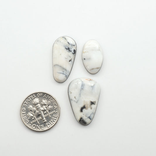 Natural White Buffalo Stone Cabochons are semi-precious gemstones cut into shapes ideal for jewelry-making, making them an excellent choice for artisans.
