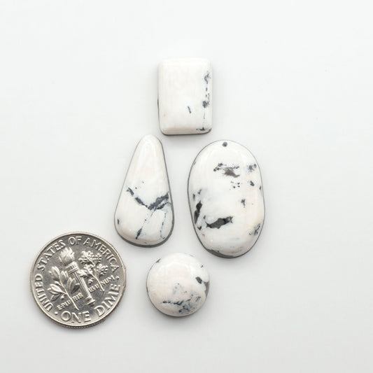Natural White Buffalo Stone Cabochons are semi-precious gemstones cut into shapes ideal for jewelry-making, making them an excellent choice for artisans.
