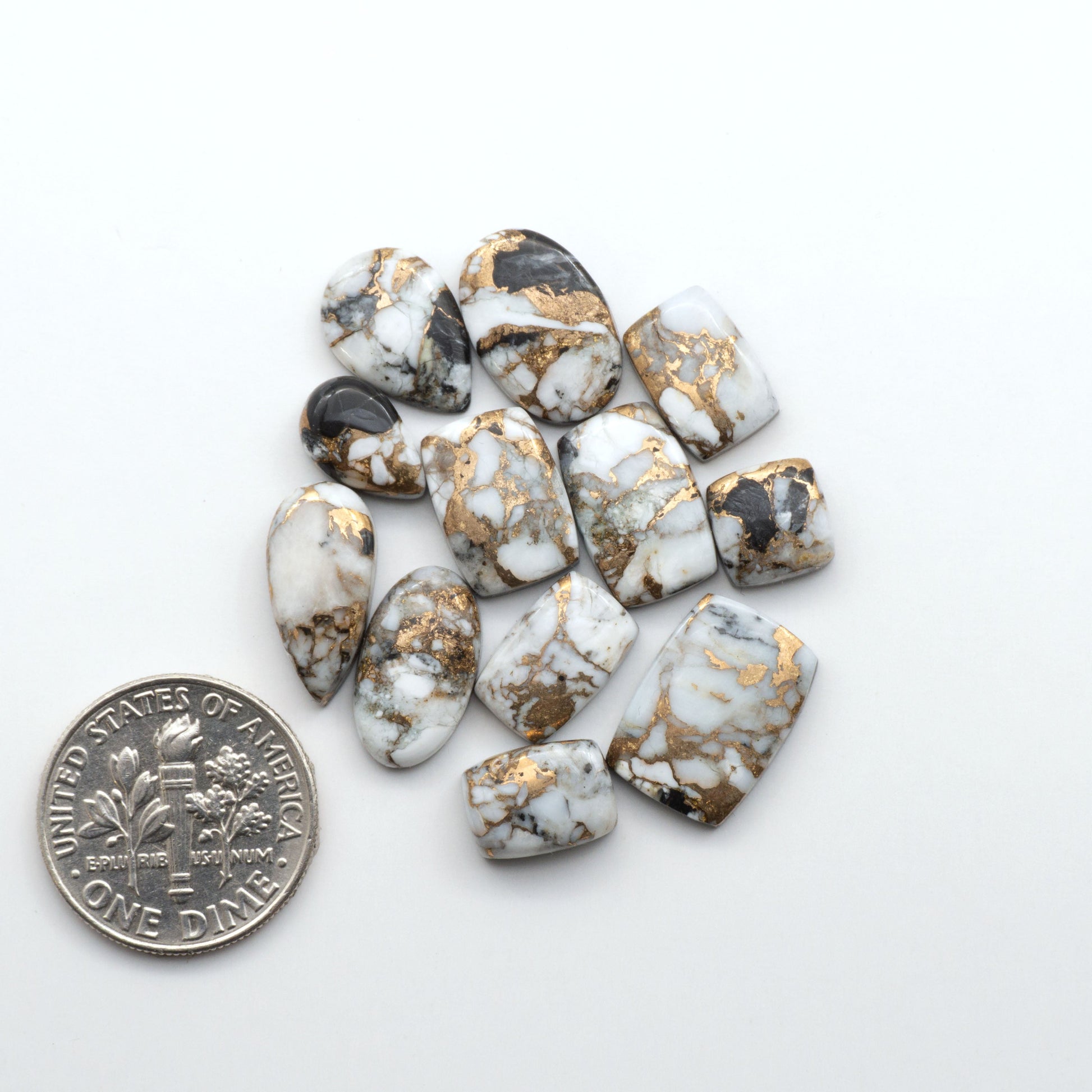 Elevate your jewelry pieces with these stunning White Buffalo Cabochons. With their unique and intricate patterns, they add a touch of elegance to any design.