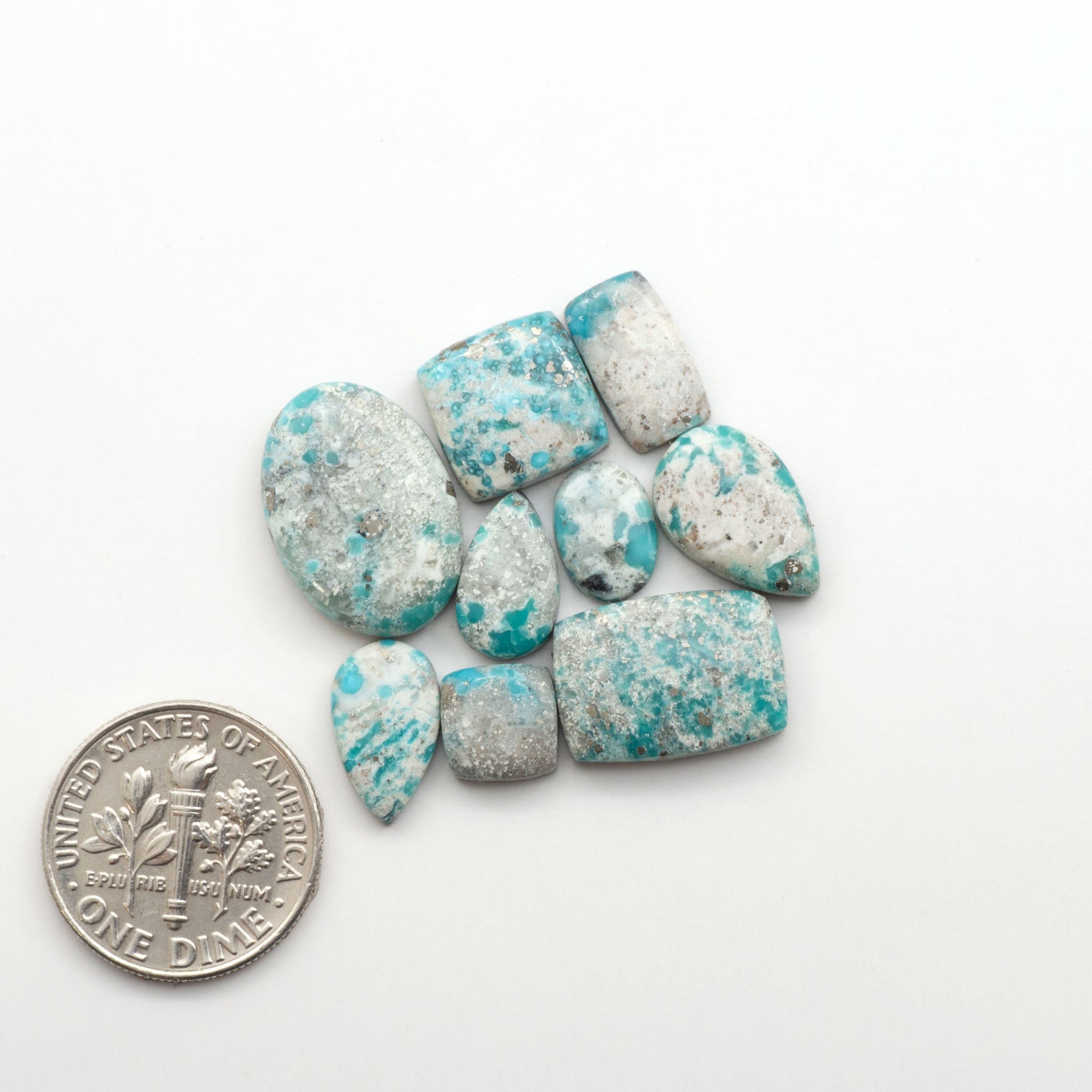 White Water Turquoise Cabochons with their mesmerizing patterns and one-of-a-kind colors, are perfect for those looking for a unique and eye-catching piece.