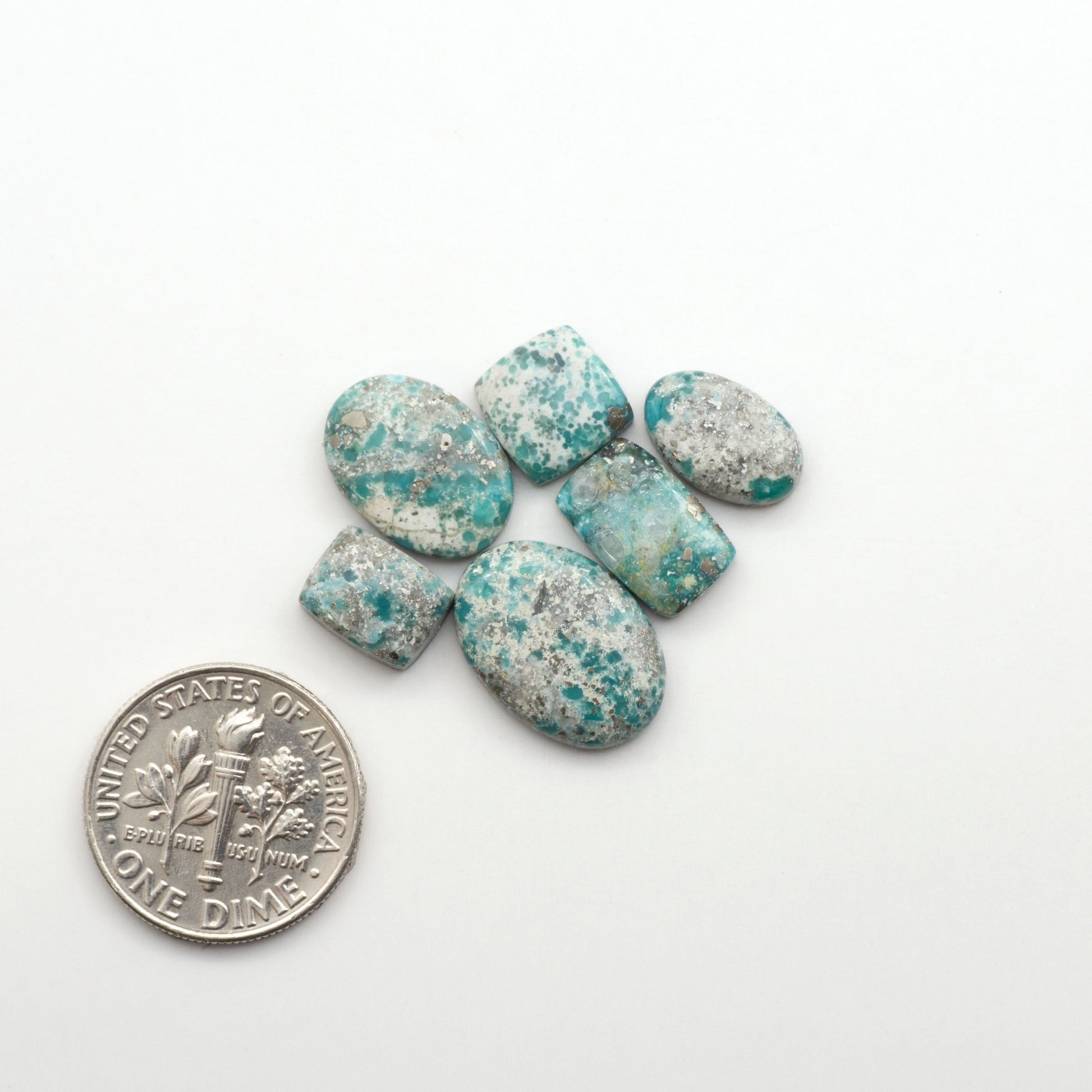 White Water Turquoise Cabochons with their mesmerizing patterns and one-of-a-kind colors, are perfect for those looking for a unique and eye-catching piece.