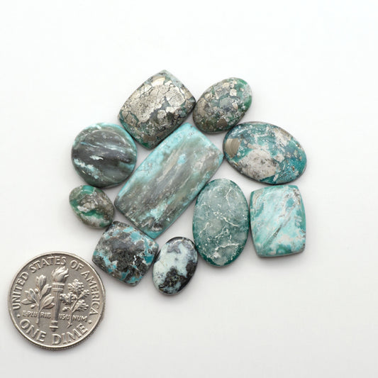 White Water Turquoise Cabochons with their mesmerizing patterns and one-of-a-kind colors, are perfect for those looking for a unique and eye-catching piece.
