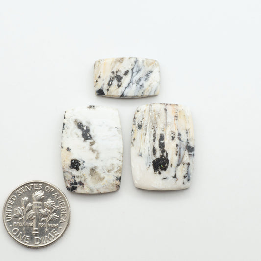Natural White Buffalo Stone Cabochons are semi-precious gemstones cut into shapes ideal for jewelry-making, making them an excellent choice for artisans.