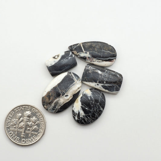Natural White Buffalo Stone Cabochons are semi-precious gemstones cut into shapes ideal for jewelry-making, making them an excellent choice for artisans.