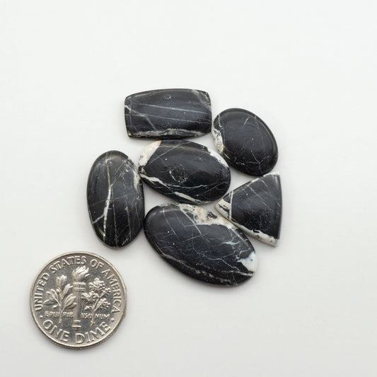 Natural White Buffalo Stone Cabochons are semi-precious gemstones cut into shapes ideal for jewelry-making, making them an excellent choice for artisans.