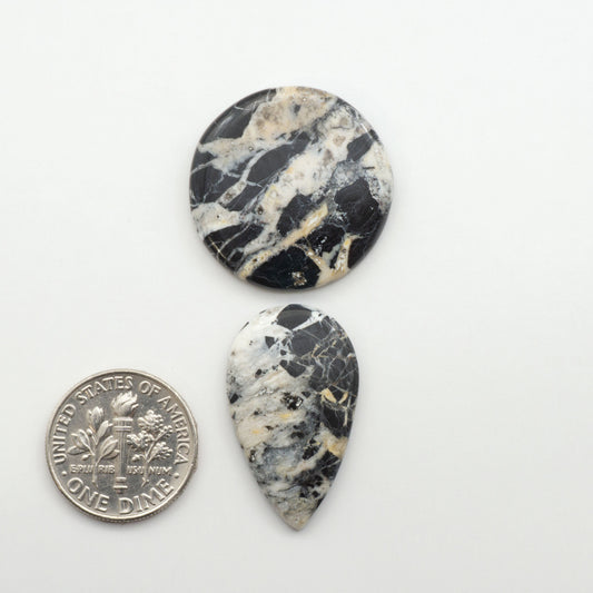 Natural White Buffalo Stone Cabochons are semi-precious gemstones cut into shapes ideal for jewelry-making, making them an excellent choice for artisans.