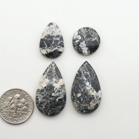 Natural White Buffalo Stone Cabochons are semi-precious gemstones cut into shapes ideal for jewelry-making, making them an excellent choice for artisans.
