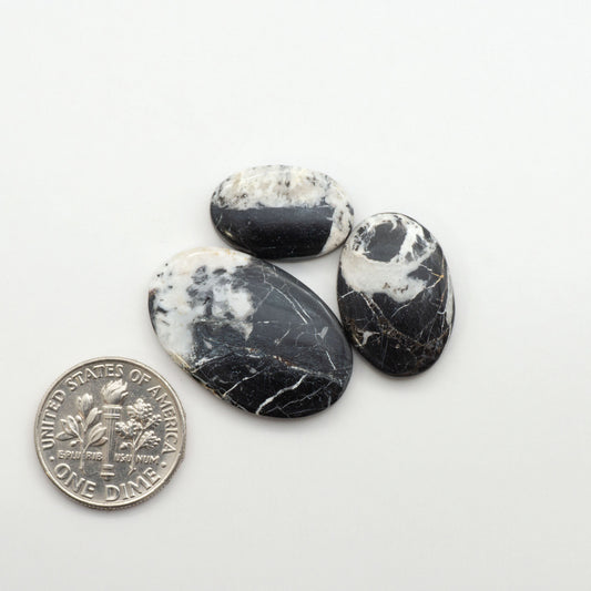 Natural White Buffalo Stone Cabochons are semi-precious gemstones cut into shapes ideal for jewelry-making, making them an excellent choice for artisans.