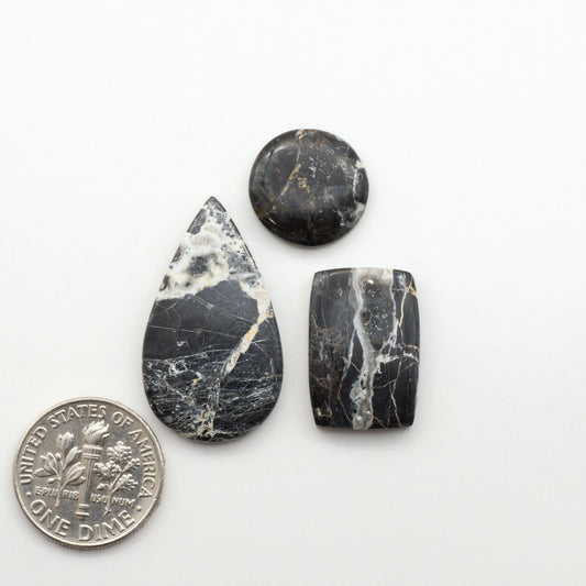 Natural White Buffalo Stone Cabochons are semi-precious gemstones cut into shapes ideal for jewelry-making, making them an excellent choice for artisans.
