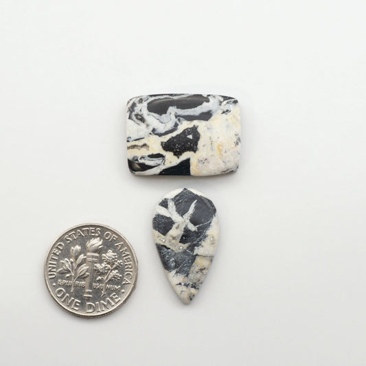 Natural White Buffalo Stone Cabochons are semi-precious gemstones cut into shapes ideal for jewelry-making, making them an excellent choice for artisans.