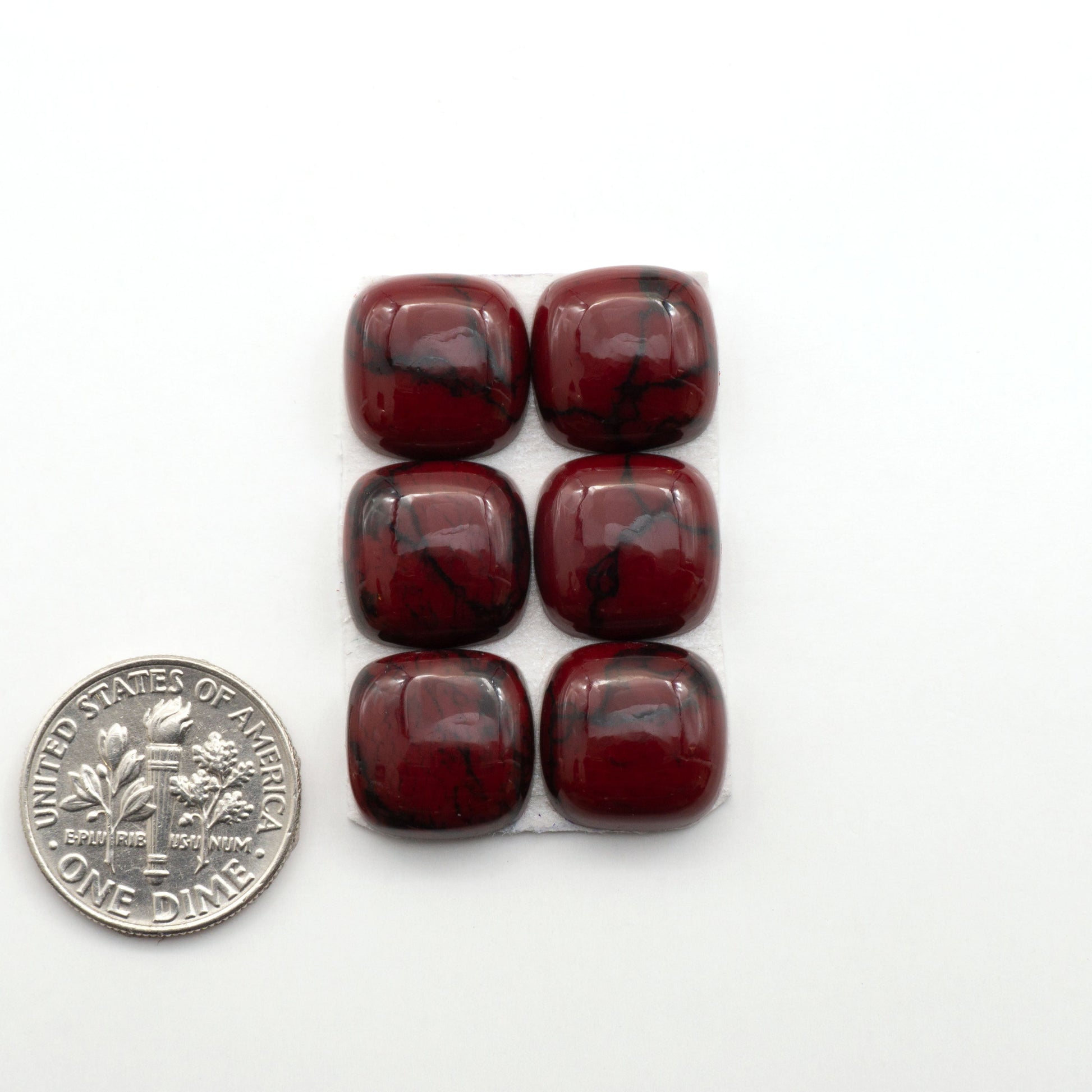 Bloody Bison Jasper is a composite stone with a vibrant red hue and black matrix that creates a strong impression and a touch of opulence to any jewelry piece.