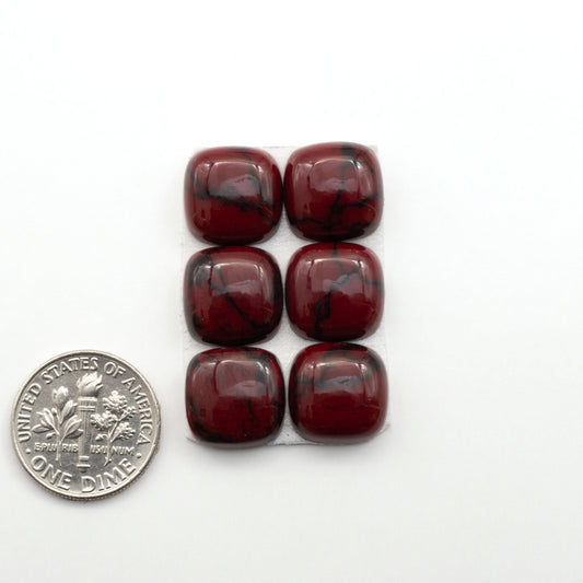 Bloody Bison Jasper is a composite stone with a vibrant red hue and black matrix that creates a strong impression and a touch of opulence to any jewelry piece.