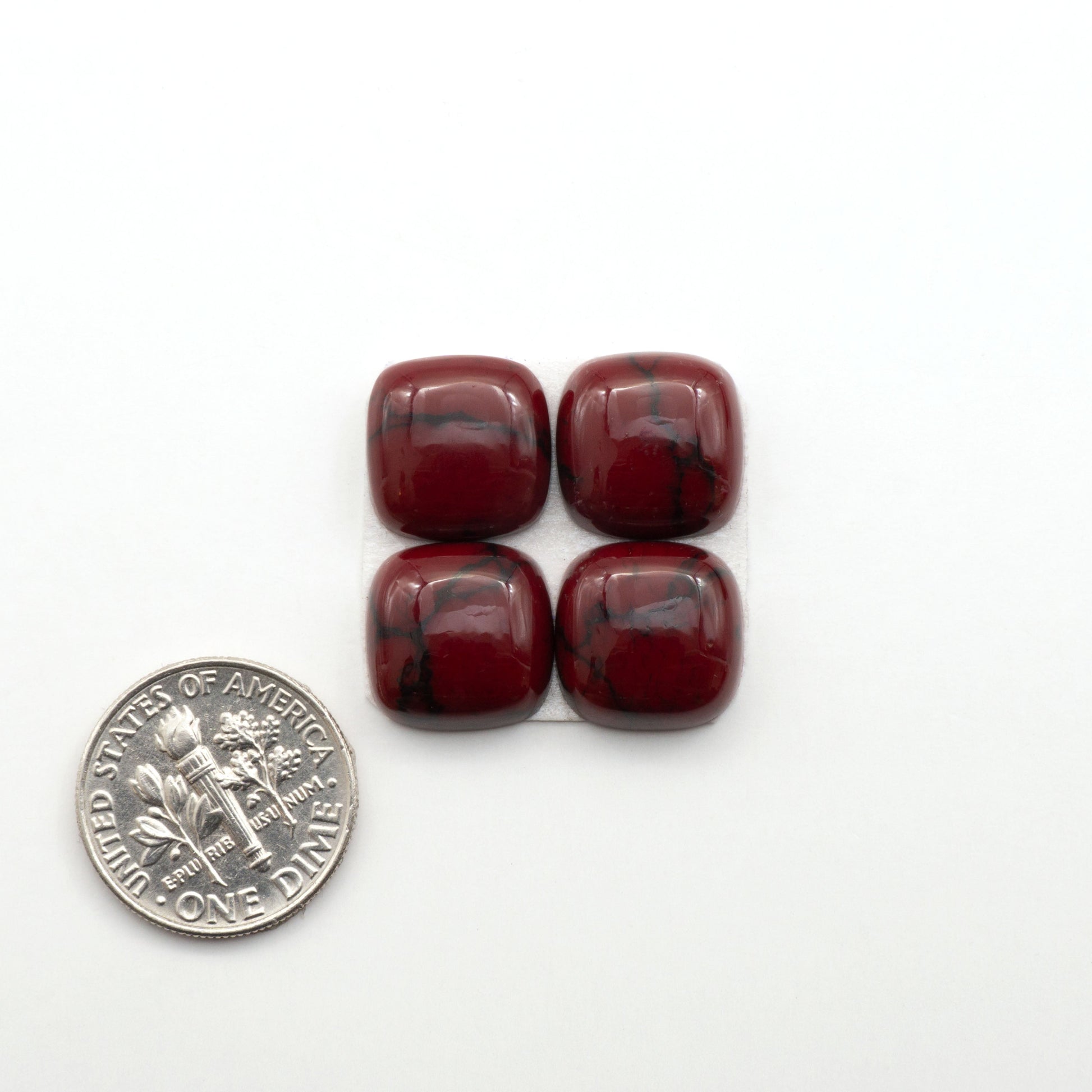 Bloody Bison Jasper is a composite stone with a vibrant red hue and black matrix that creates a strong impression and a touch of opulence to any jewelry piece.