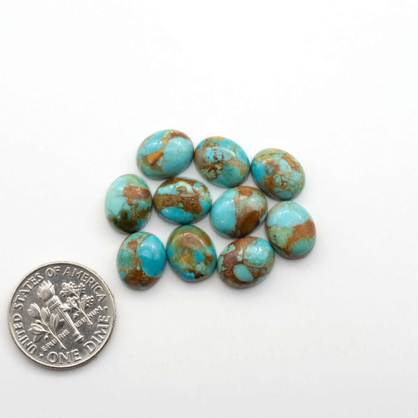 Enhance your jewelry designs with Pressed Turquoise Nugget Cabochons. Crafted from composite materials they add a captivating touch to your creations.