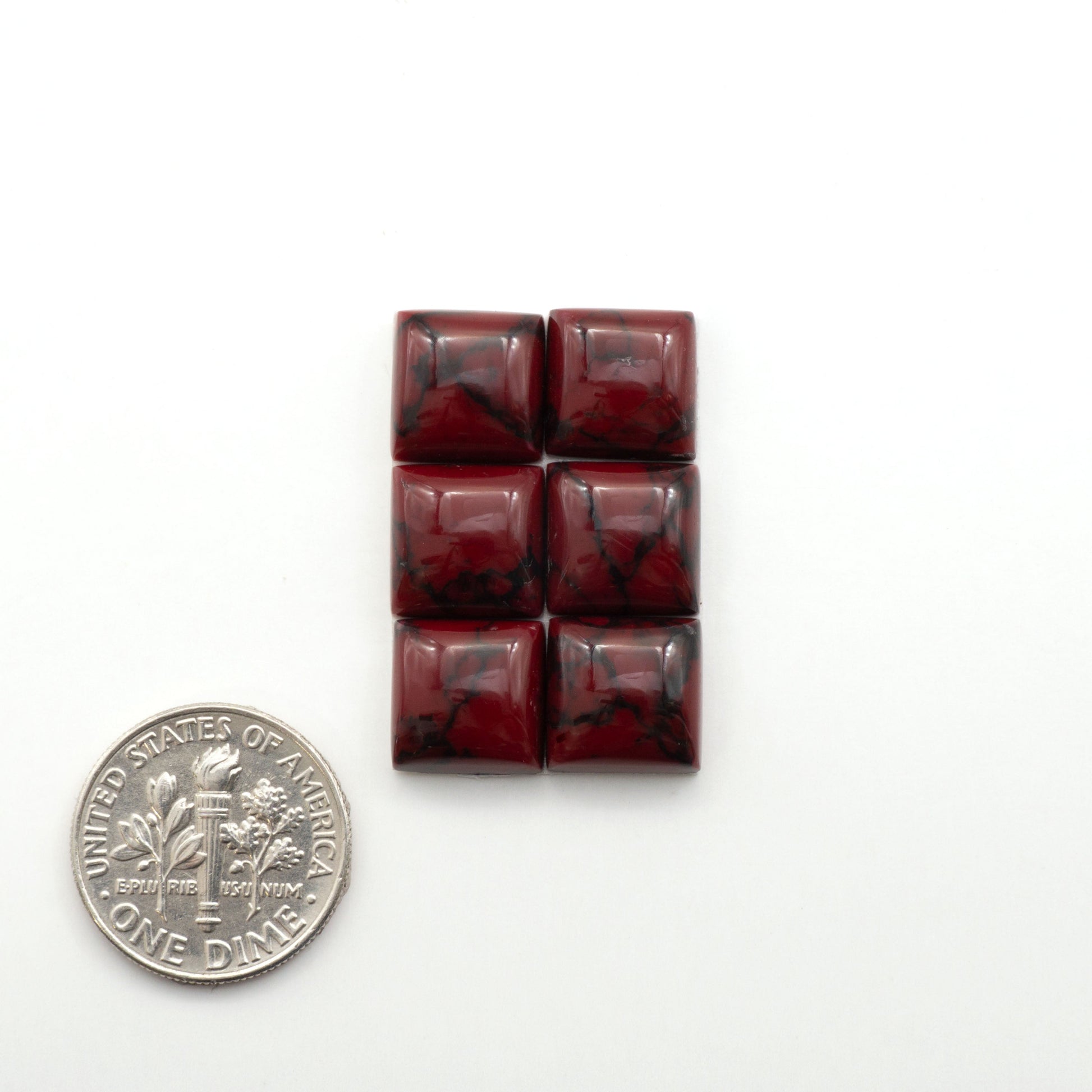 Bloody Bison Jasper is a composite stone with a vibrant red hue and black matrix that creates a strong impression and a touch of opulence to any jewelry piece.