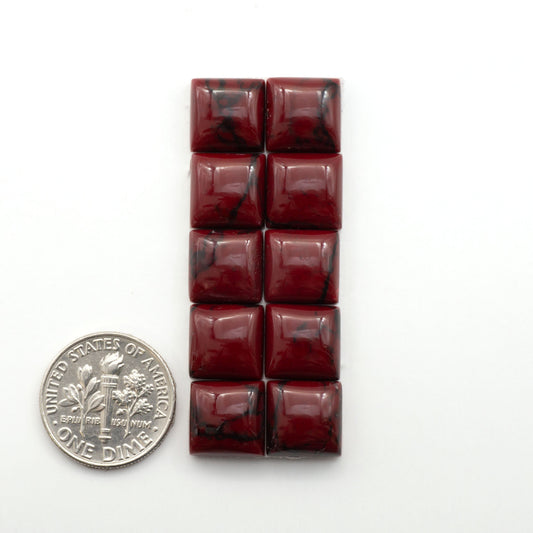 Bloody Bison Jasper is a composite stone with a vibrant red hue and black matrix that creates a strong impression and a touch of opulence to any jewelry piece.