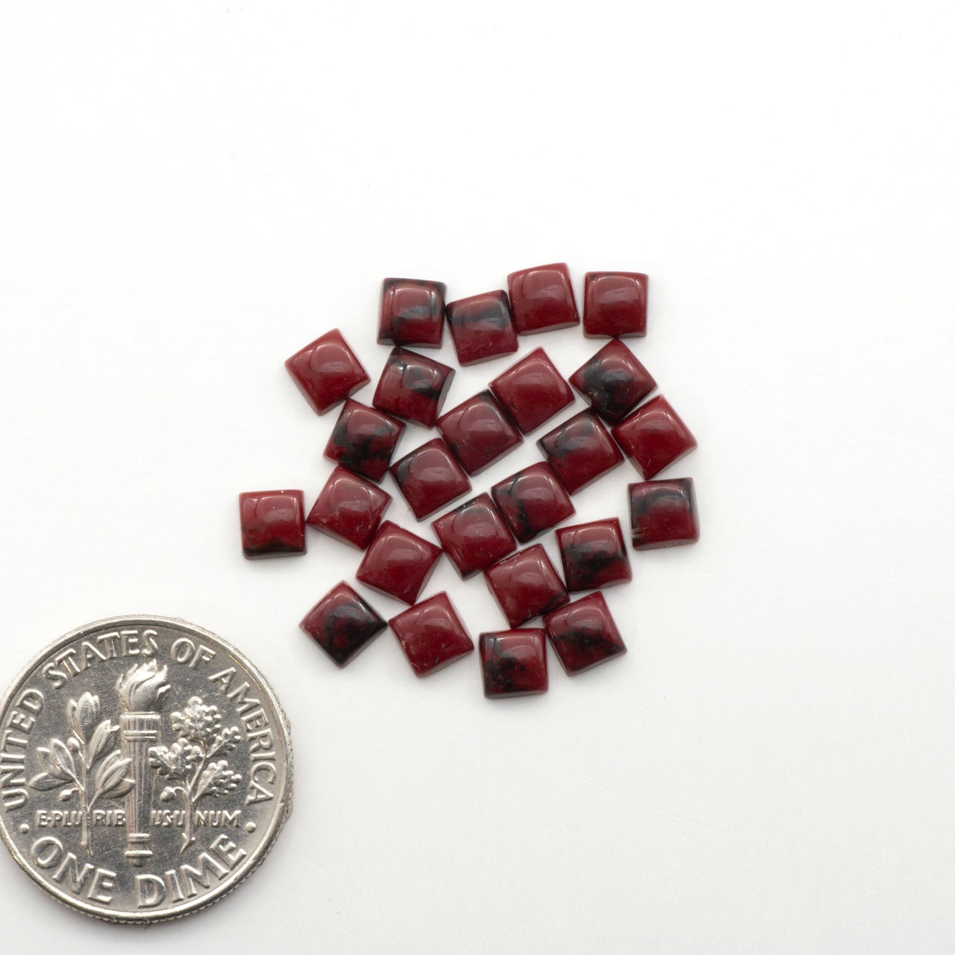 Bloody Bison Jasper is a composite stone with a vibrant red hue and black matrix that creates a strong impression and a touch of opulence to any jewelry piece.