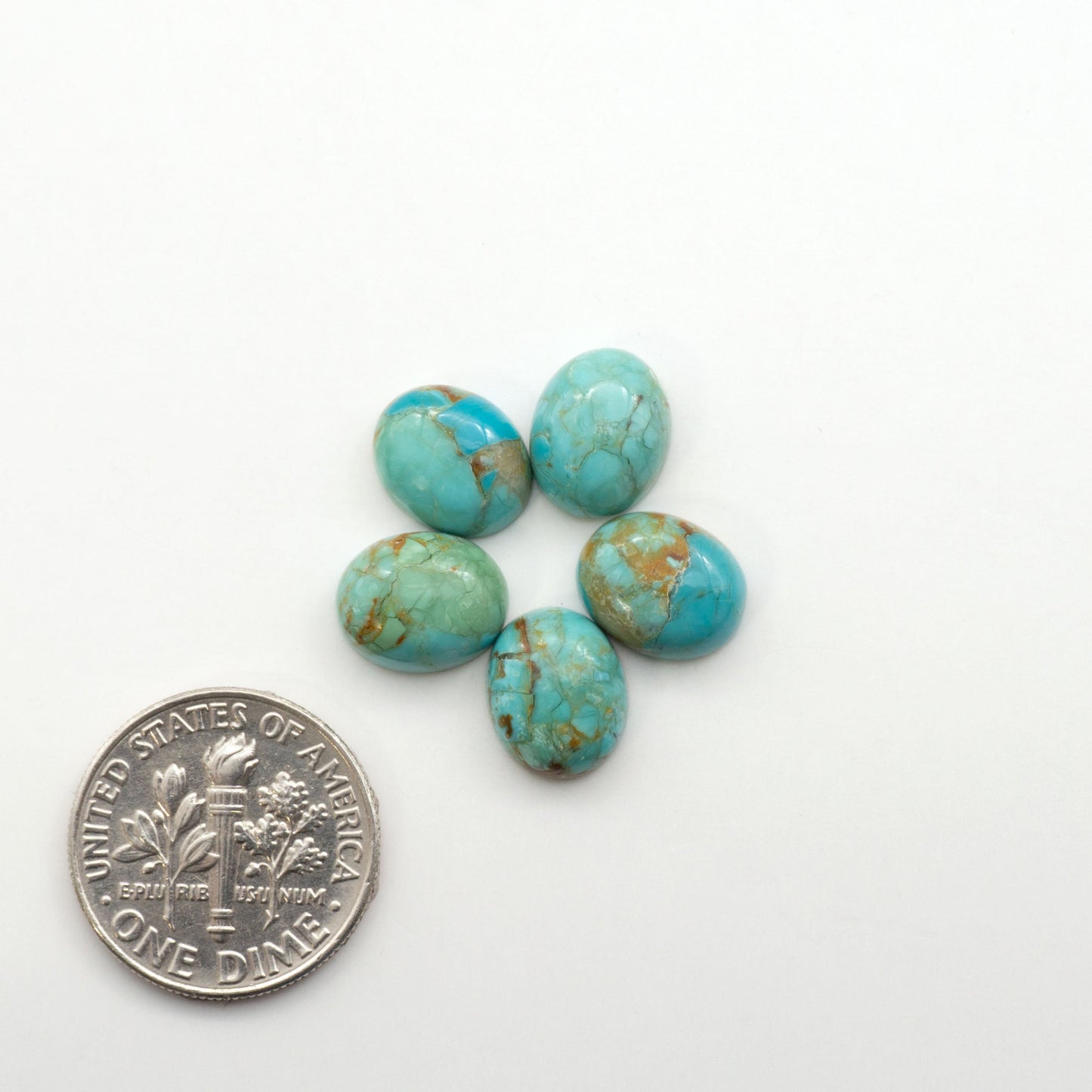 Enhance your jewelry designs with Pressed Turquoise Nugget Cabochons. Crafted from composite materials they add a captivating touch to your creations.