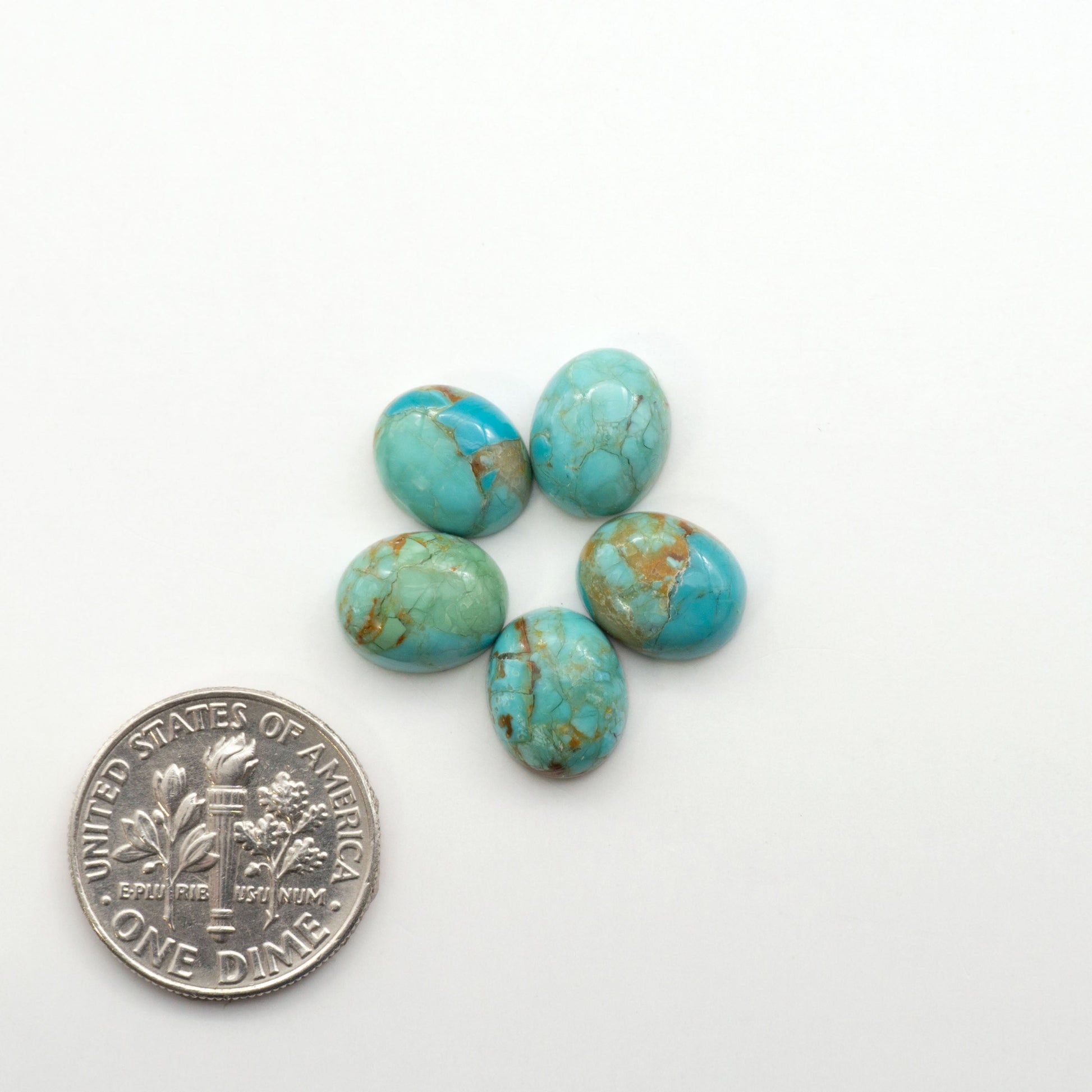 Enhance your jewelry designs with Pressed Turquoise Nugget Cabochons. Crafted from composite materials they add a captivating touch to your creations.