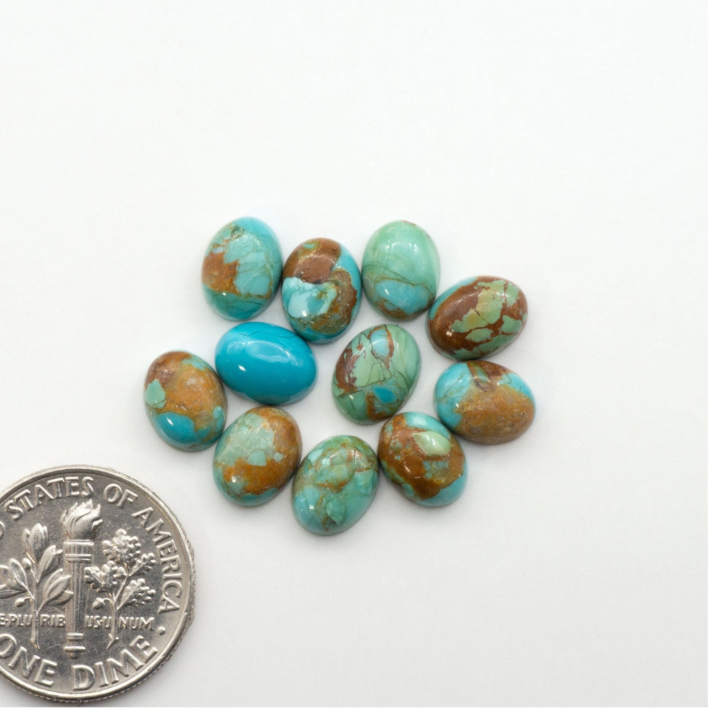 Enhance your jewelry designs with Pressed Turquoise Nugget Cabochons. Crafted from composite materials they add a captivating touch to your creations.