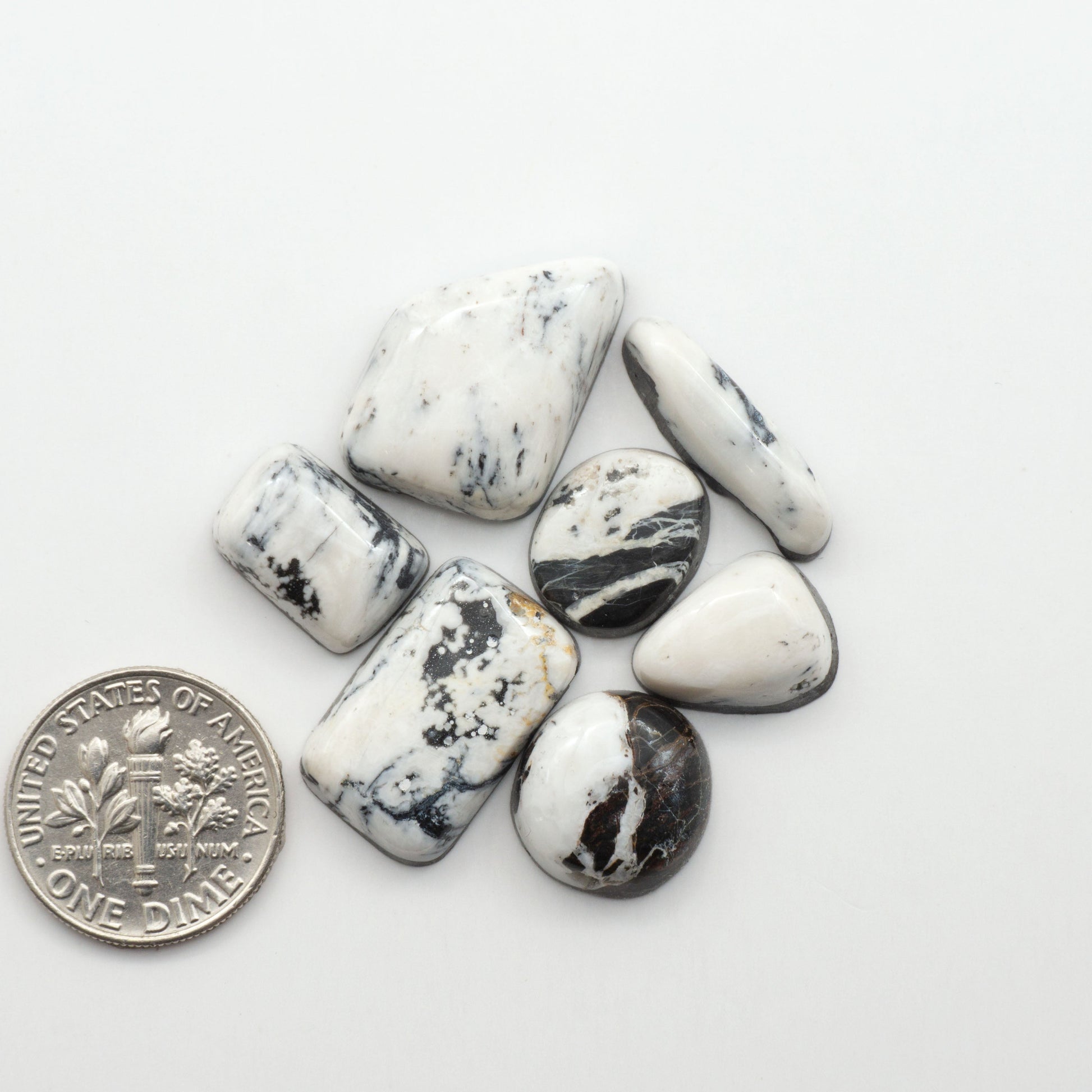 Natural White Buffalo Stone Cabochons are semi-precious gemstones cut into shapes ideal for jewelry-making, making them an excellent choice for artisans.